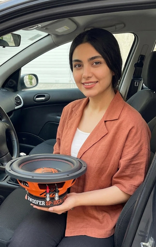 SP 10CA subwoofer seen from the front seat of a car, cone and terminals in view