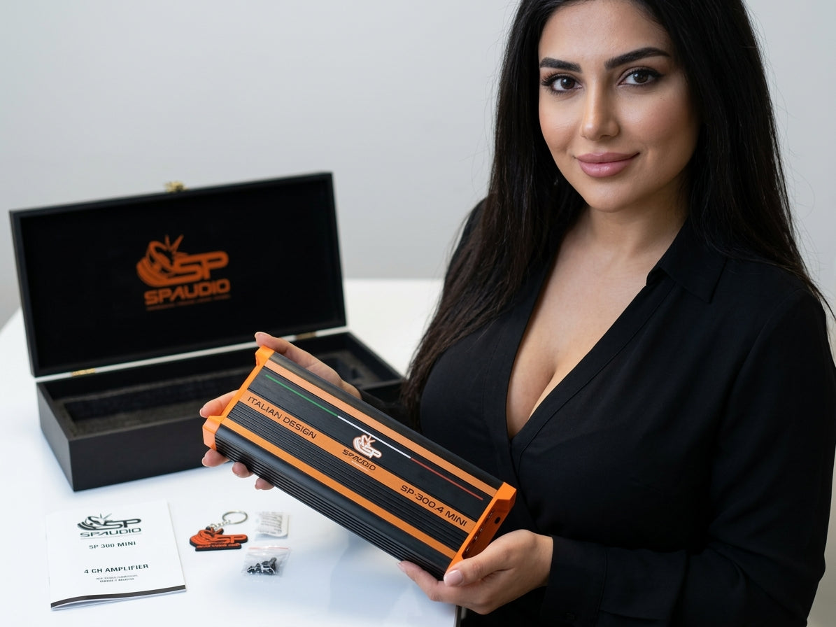 SP-300.4 MINI shown next to its open black collector's wooden case and printed manual